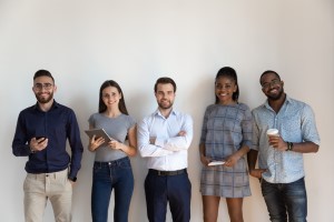 Group of peope standing and smiling