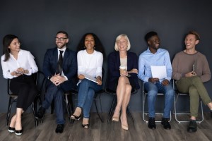 Group of peope sitting and smiling