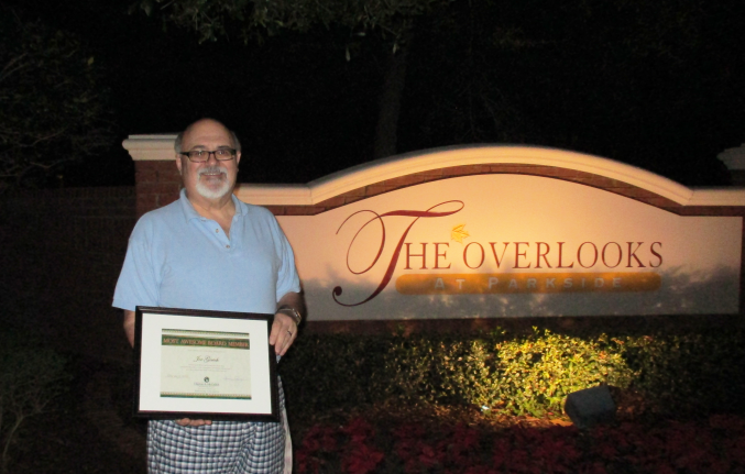 Joe Gerich holding his award